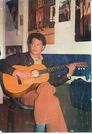 Description: A younger Jack softly strumming his guitar
